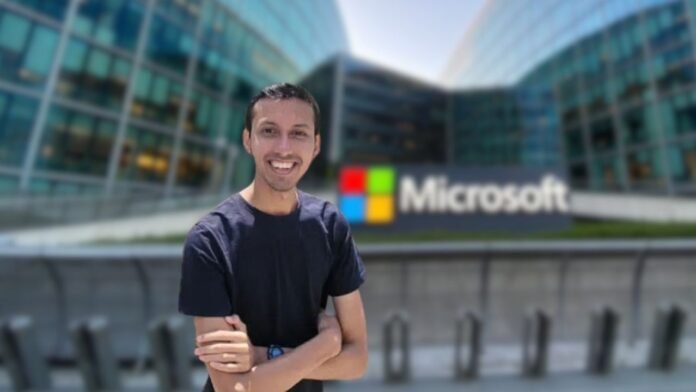 Mohammad Asifuzzaman standing in front of a Microsoft building, smiling confidently in business casuals.