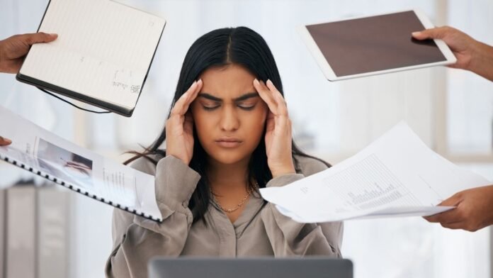 A young professional taking a mindful break from work to prevent burnout and boost productivity